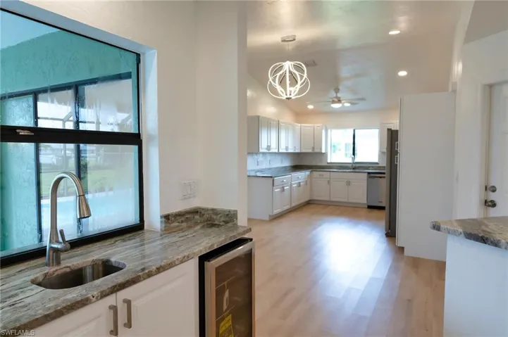 Wine Cooler and quartz countertops at the bar.