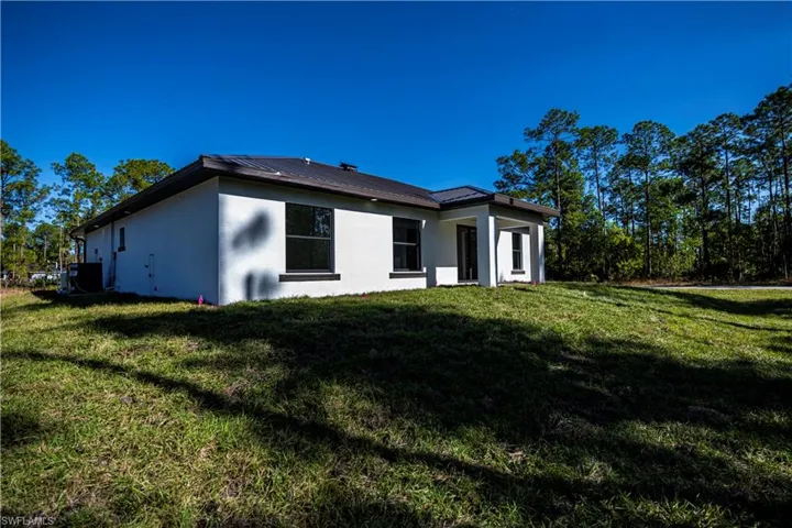 View of home's exterior featuring a lawn