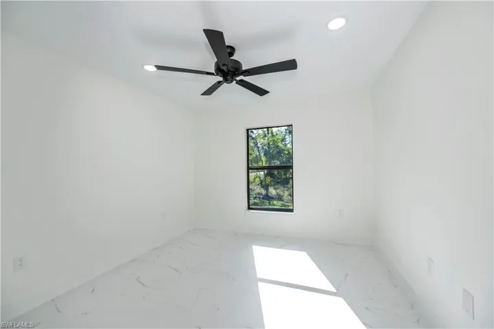 Unfurnished room with ceiling fan