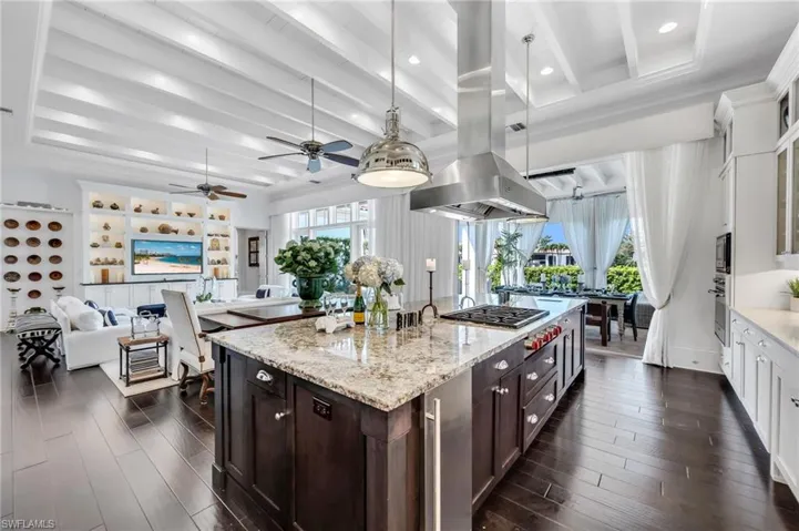 Chef's kitchen with high-end appliances and open living concept.