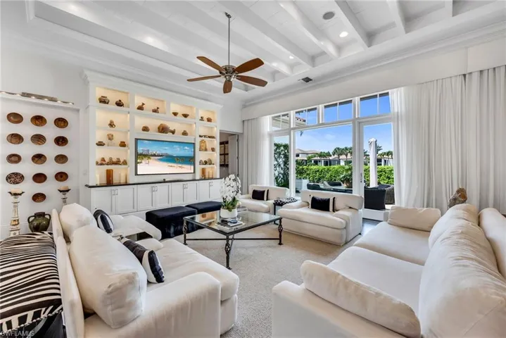 The great room also has automated sun shades to bring calm and coolness to the interiors.