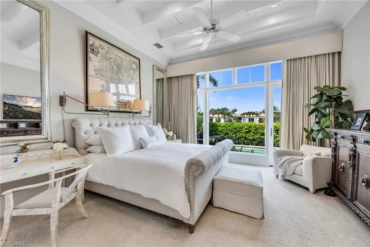 Owner's Suite is spacious, yet cozy-feeling, with beautiful views and French doors out to the pool.