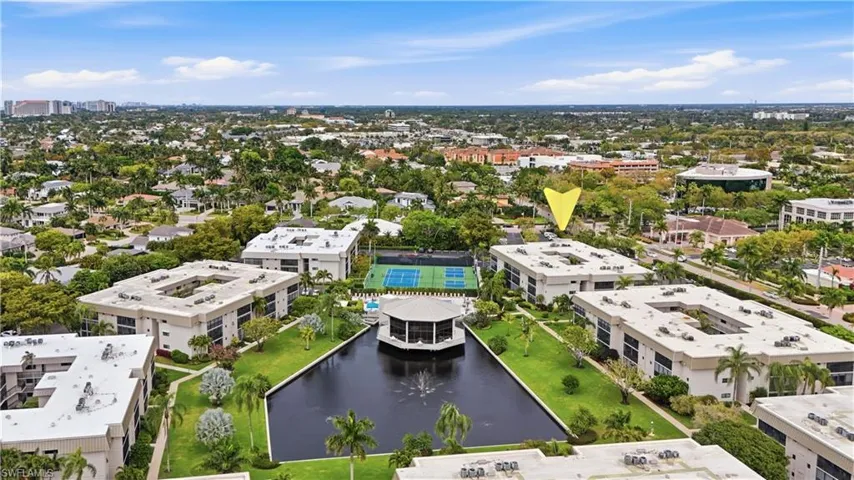 Aerial view of a large body of water and apartment complex / building