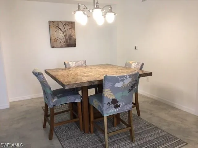 Dining space featuring a notable chandelier