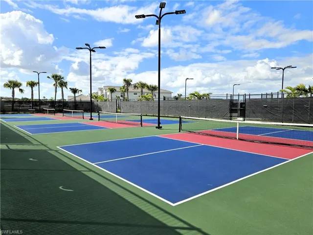 View of tennis court featuring community basketball court