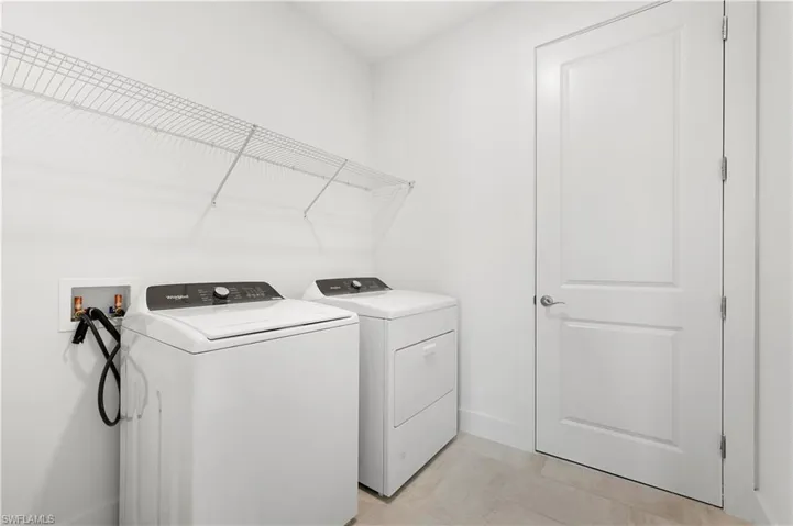 Laundry room with washer and gas dryer