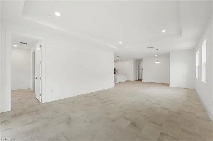 Open-concept floor plan with great room and casual dining pictured