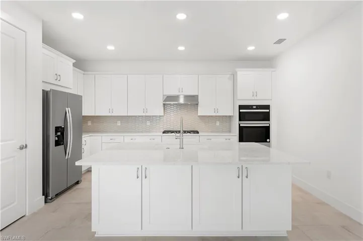 Kitchen layout with beautiful center island with additional cabinetry for storage