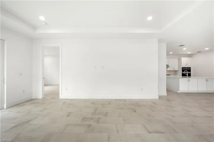Great room living space with tray ceiling