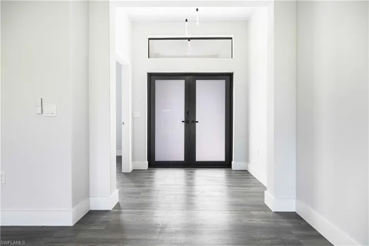 Entrance foyer featuring dark wood-type flooring