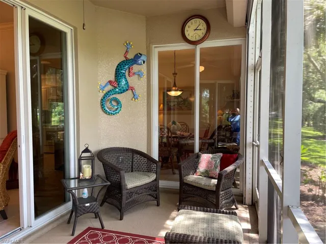 Lanai with view of golf course and lake