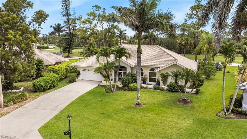 Front elevation of home. Over-sized golf course lot.