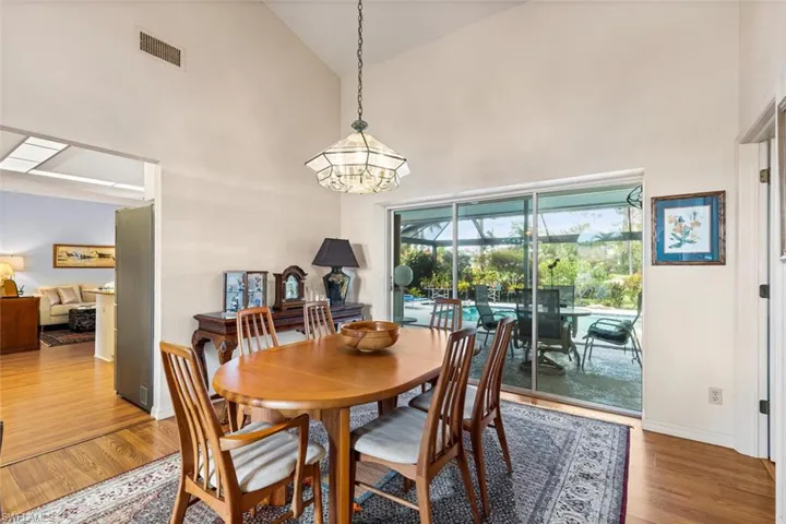 Dining Room entry to Kitchen and Views to Pool.