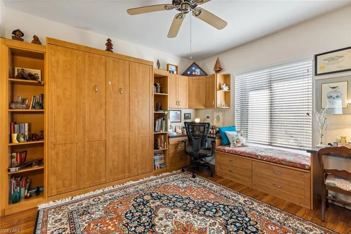 Guest Bedroom 2. Custom built-in Murphy bed, 2 desks and window seat.