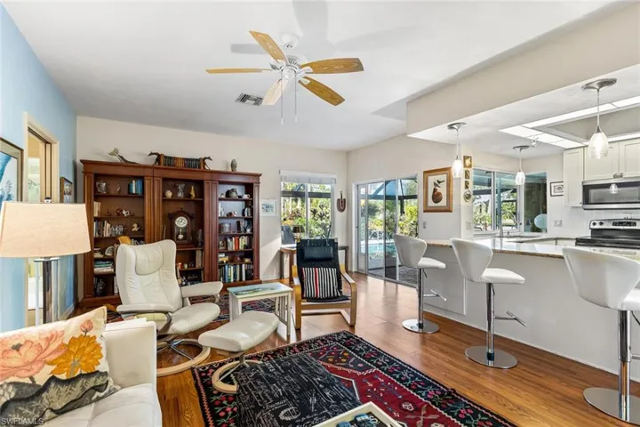 Family Room and Kitchen are heart of this home. Entry to pool area.