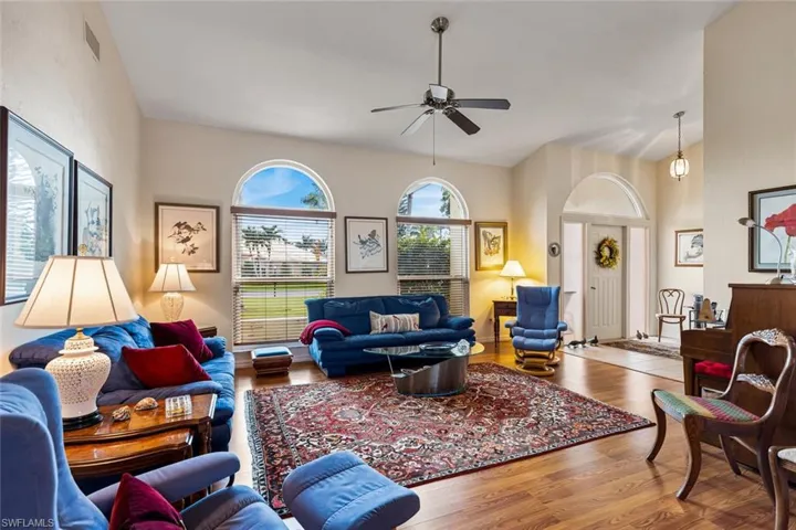 Actual front door into entry / living room. Volume ceilings. Laminate floors.