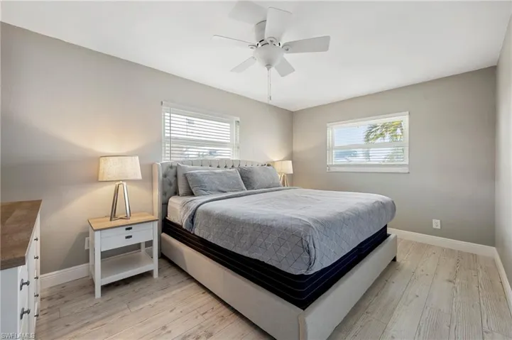 Bedroom featuring light wood finished floors and a ceiling fan