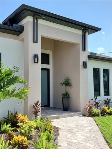 Property entrance featuring a patio area
