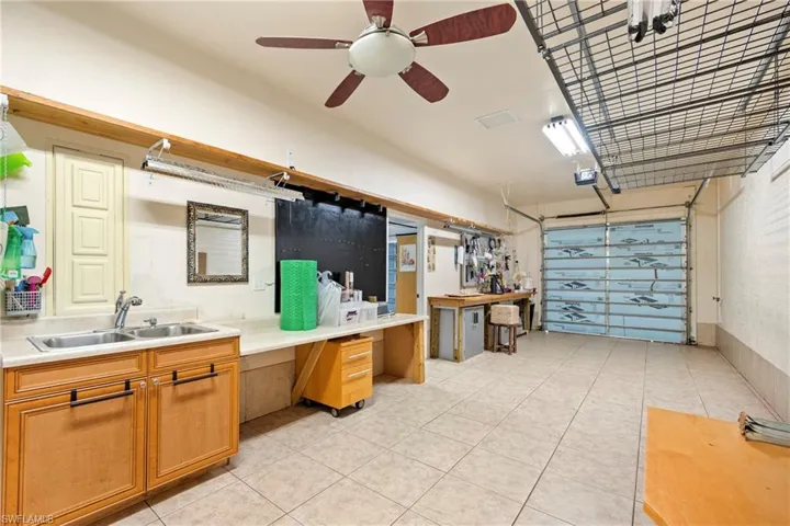Garage featuring a sink and ceiling fan
