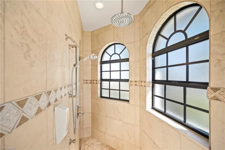 Full bath with tiled shower