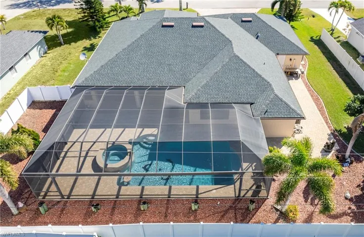 View of subject property with a pool