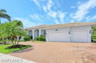 Mediterranean / spanish house featuring a garage