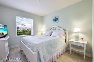 Bedroom featuring light tile patterned flooring