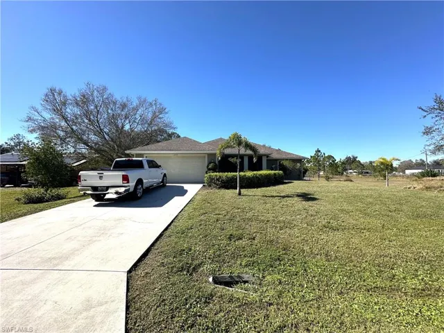 1407  Roosevelt  AVE, Lehigh Acres, FL 33972