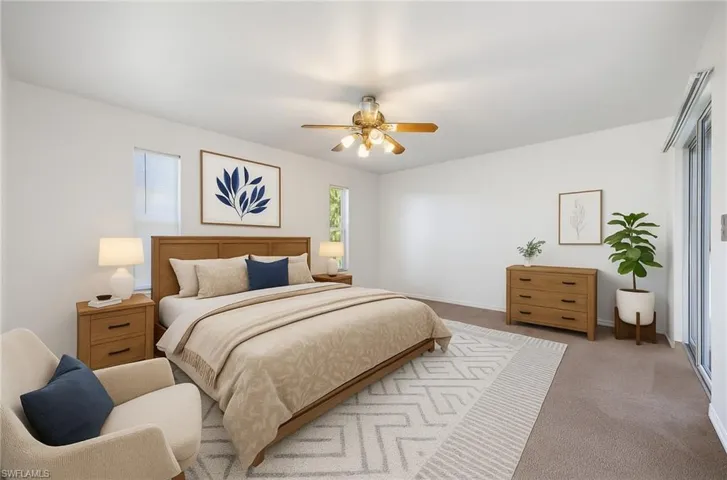 Bedroom with carpet flooring and ceiling fan