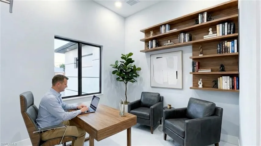 Sitting room featuring a desk