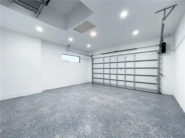 Back of property with a fenced backyard, roof with shingles, a patio area, a residential view, and stucco siding