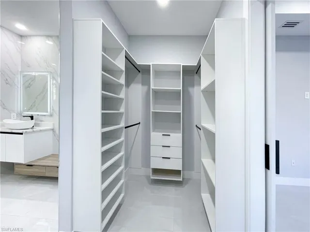 Walk in closet with a sink