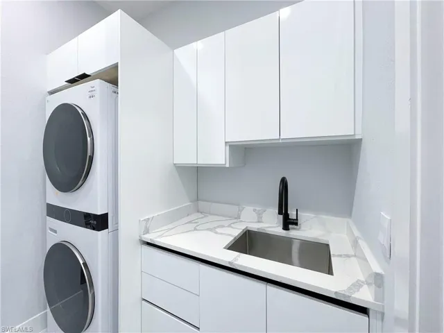 Garage with recessed lighting and electric panel