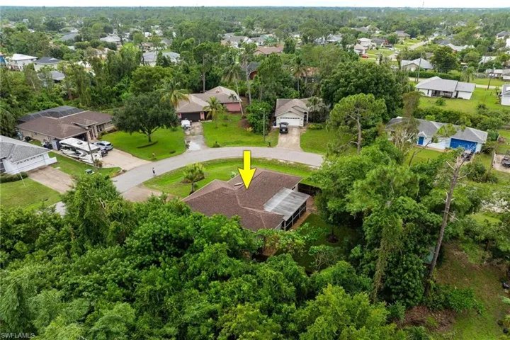 Aerial of back of home with private yard