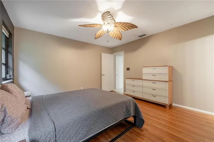 Primary bedroom with laminate flooring