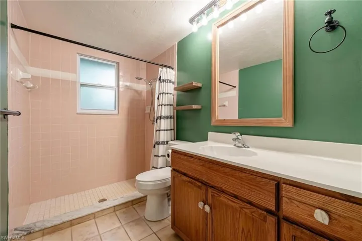 Primary bathroom with large vanity & step-in shower