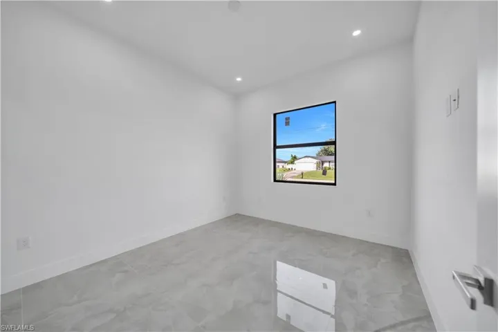 Empty room featuring recessed lighting