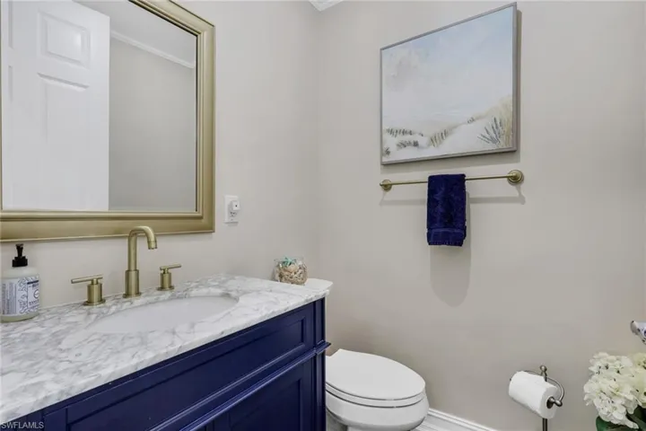 Bathroom featuring vanity and ornamental molding
