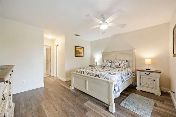 Bedroom with light wood-style floors and ceiling fan