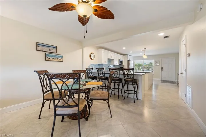 Dining space featuring recessed lighting, a ceiling fan, and light tile patterned flooring