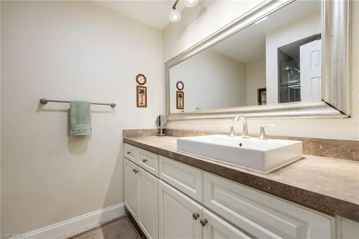 Bathroom with vanity and a shower with shower door