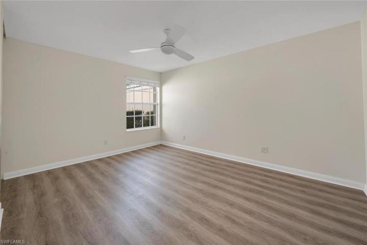 Guest bedroom with new luxury vinyl plank flooring