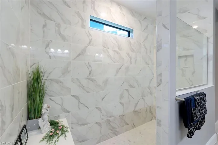 Bathroom with tiled shower