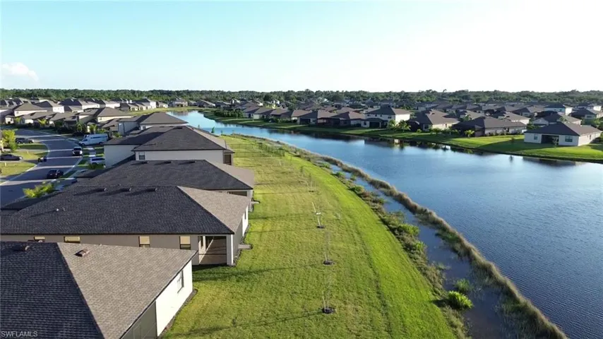 Aerial view of residential area with a nearby body of water