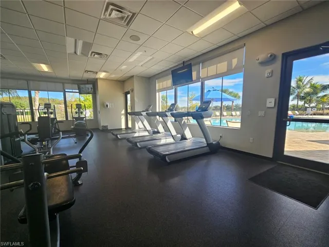 Exercise room featuring a drop ceiling