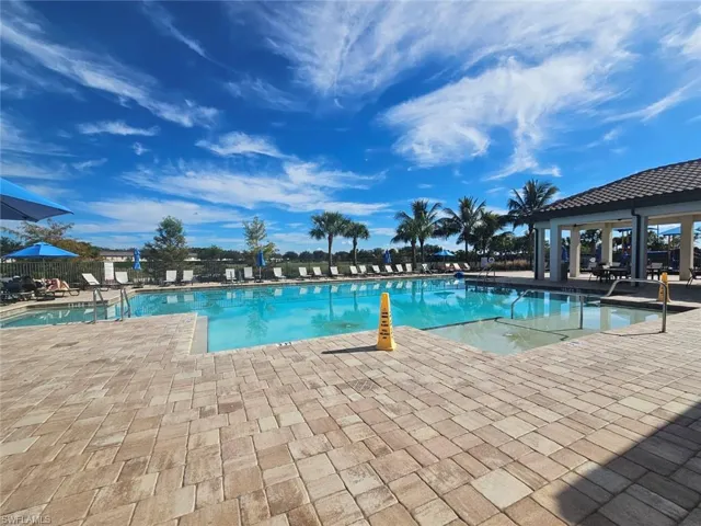 Community pool featuring a patio area