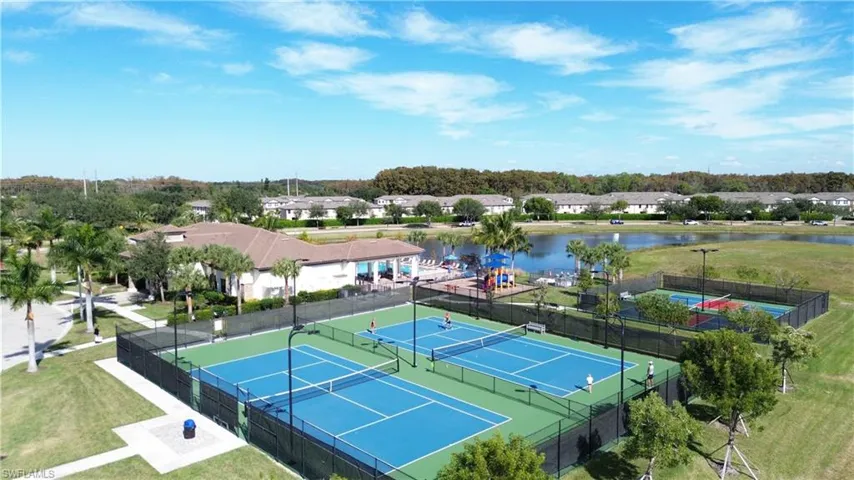 Aerial perspective of suburban area with a nearby body of water