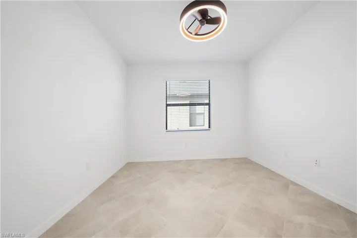 Spare room featuring baseboards