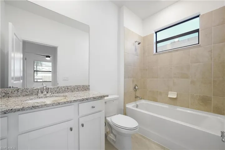 Bathroom with bathtub / shower combination and vanity