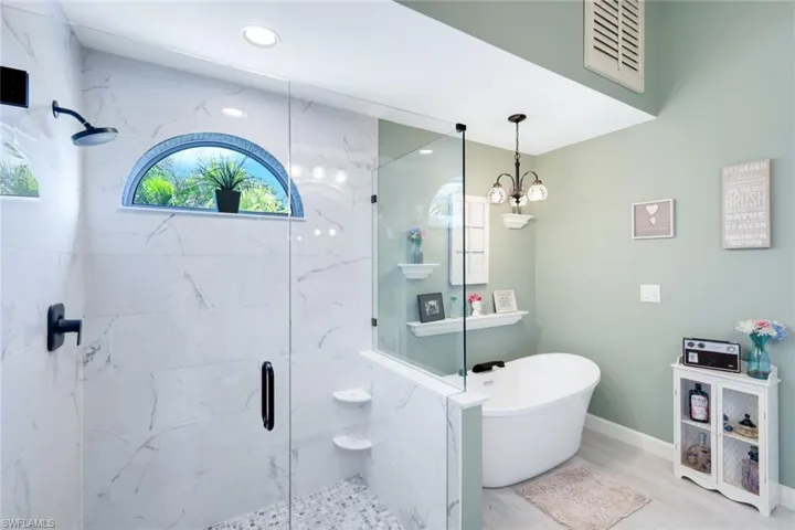 Primary bathroom with separate tub and shower